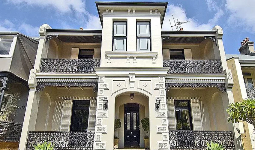 Restored heritage terrace facade with cast-iron lacework, Paddington